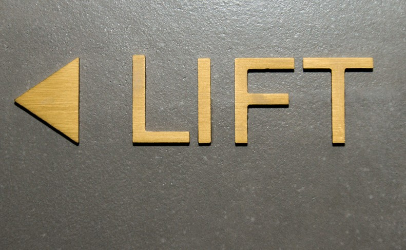 Gold LIFT directional sign
